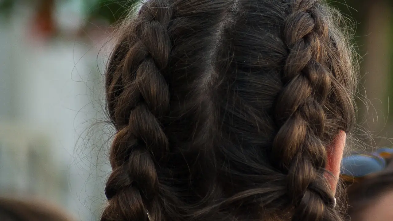 overhead view of corned beef sliced and on a platter with cabbage, potatoes, and carrots