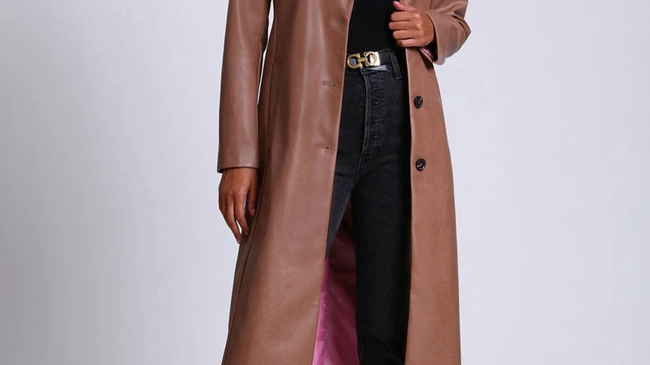 Two mint chocolate milkshakes with whipped cream and green sprinkles.