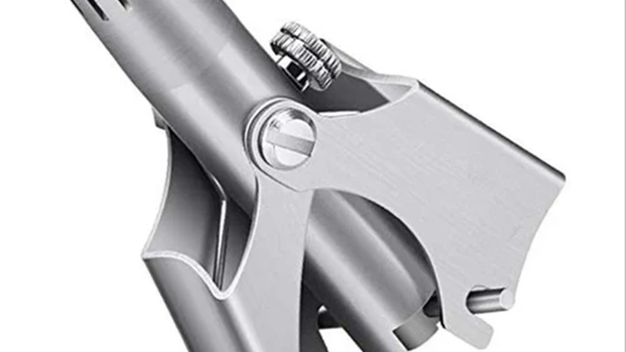 blue bowl of black bean beef tortilla soup on a board with cilantro and shredded cheese in background