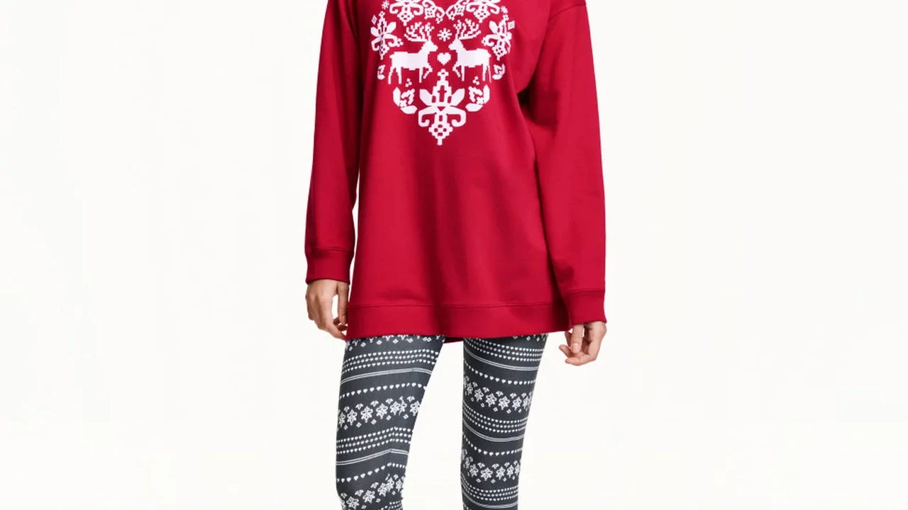 blue bowl of black bean beef tortilla soup on a board with cilantro and shredded cheese in background