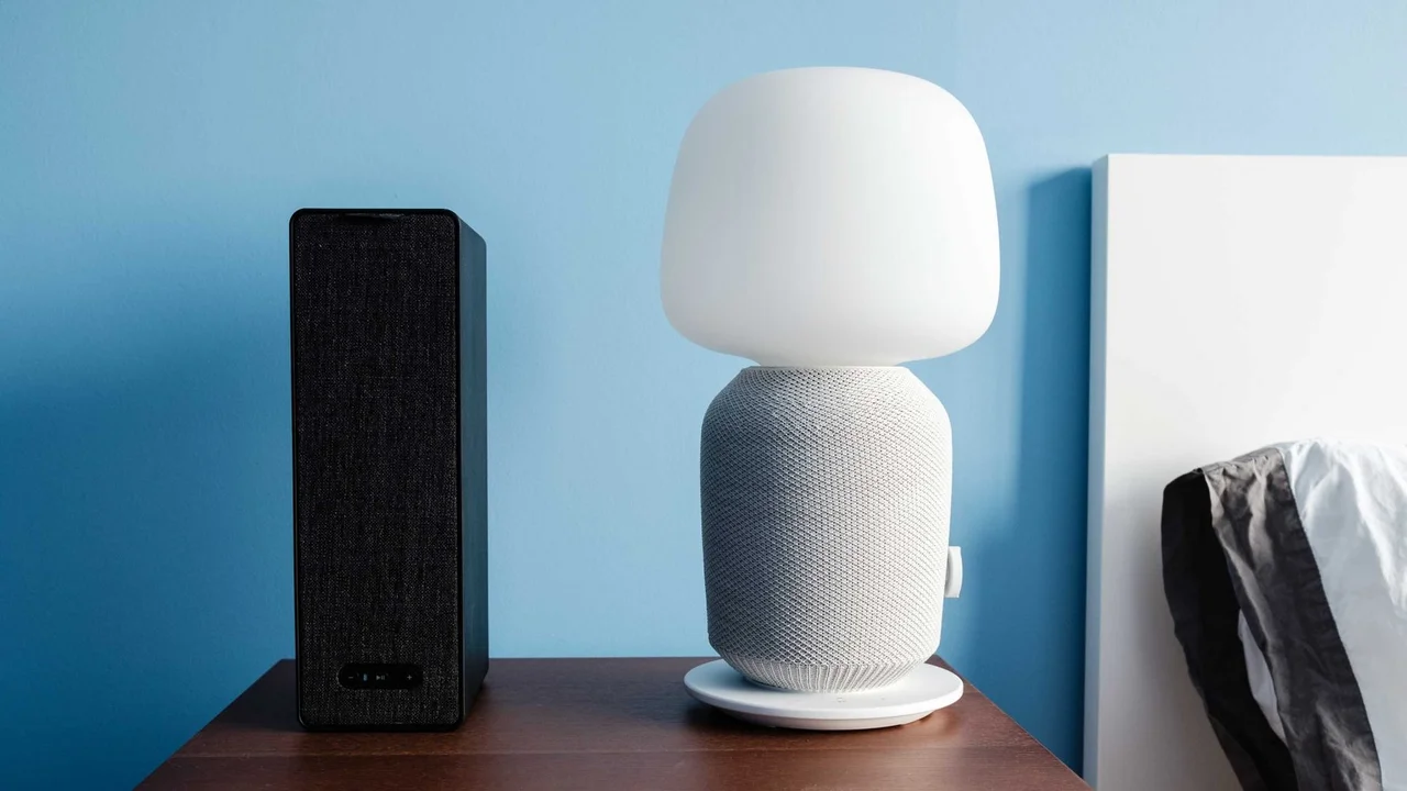 blue bowl of black bean beef tortilla soup on a board with cilantro and shredded cheese in background