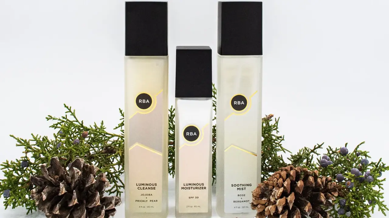 overhead view of corned beef sliced and on a platter with cabbage, potatoes, and carrots