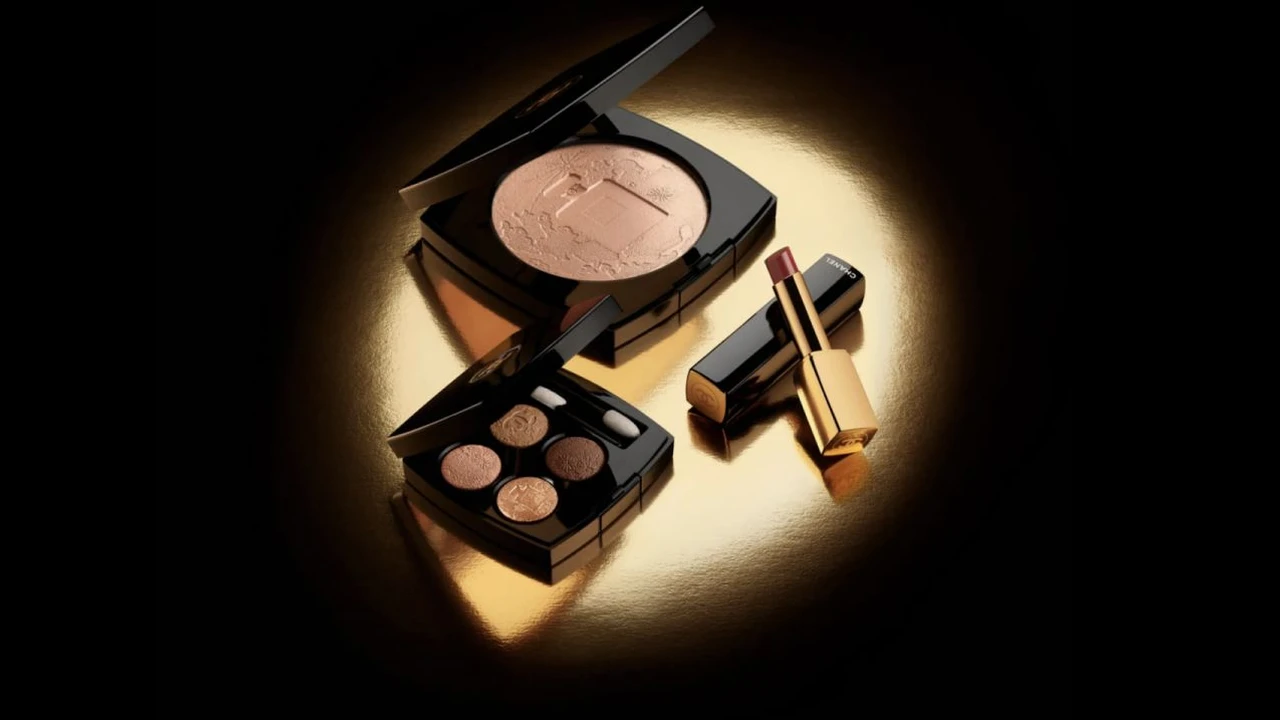 Two mint chocolate milkshakes with whipped cream and green sprinkles.