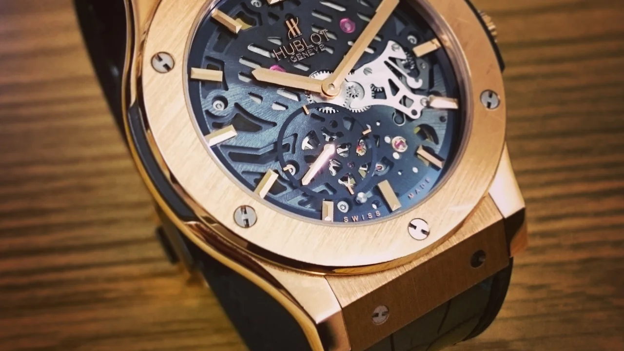 Close up on a plate of mashed potatoes, topped with baked pork chops with cream of mushroom soup, and a side of green beans.